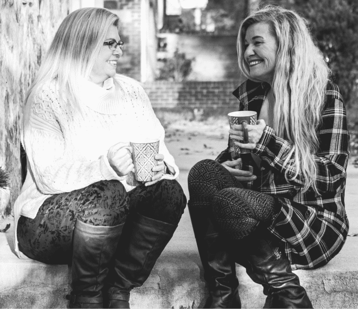 Amy, patient with Pseudobulbar Affect (PBA) and her friend and caregiver Laura, talking over coffee