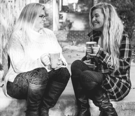 Amy, patient with Pseudobulbar Affect (PBA) and her friend and caregiver Laura, talking over coffee